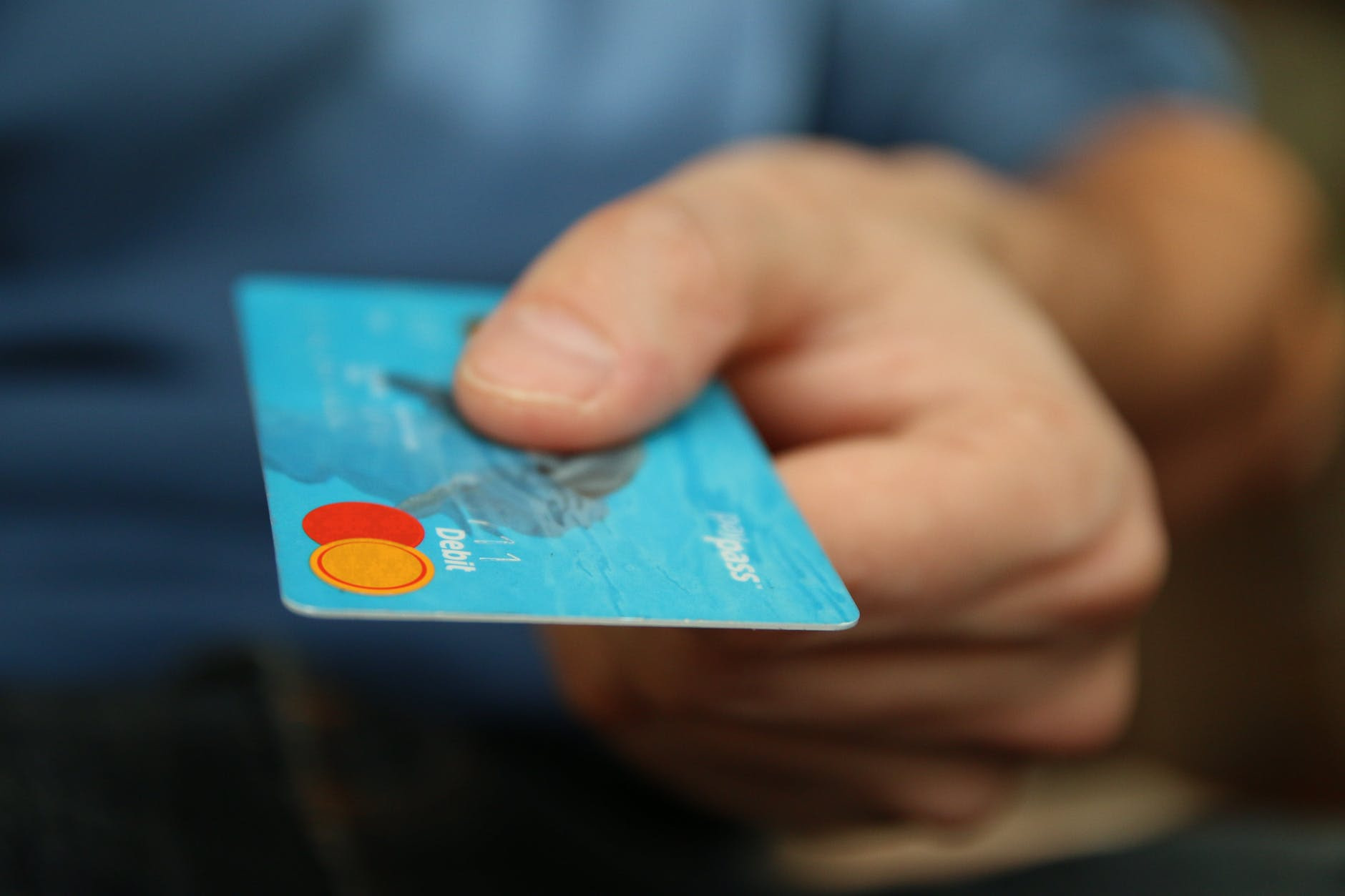 e-commerce in Nigeria person holding debit card