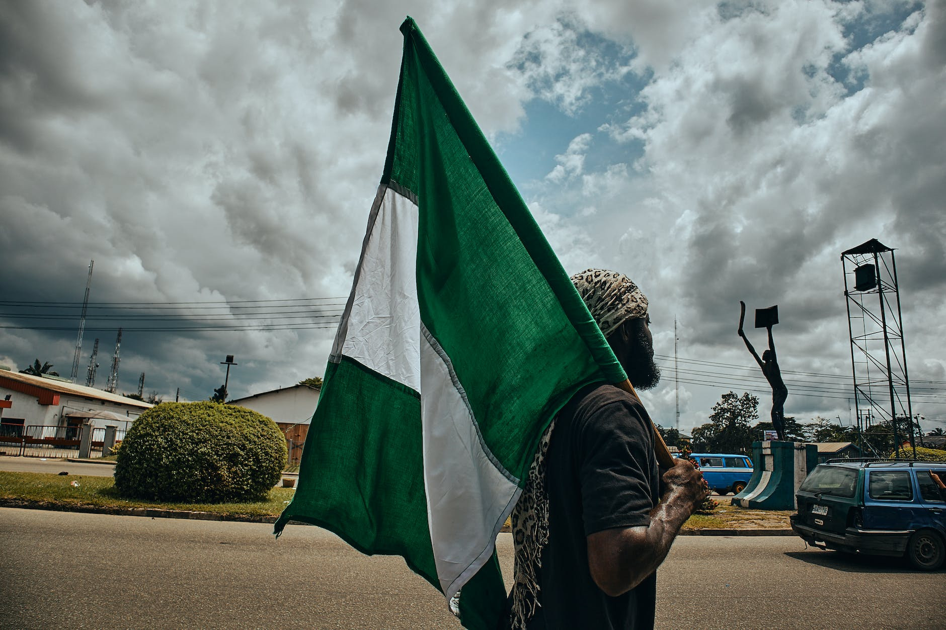 man holding a flag of nigeria digital marketing for fintech in Nigeria