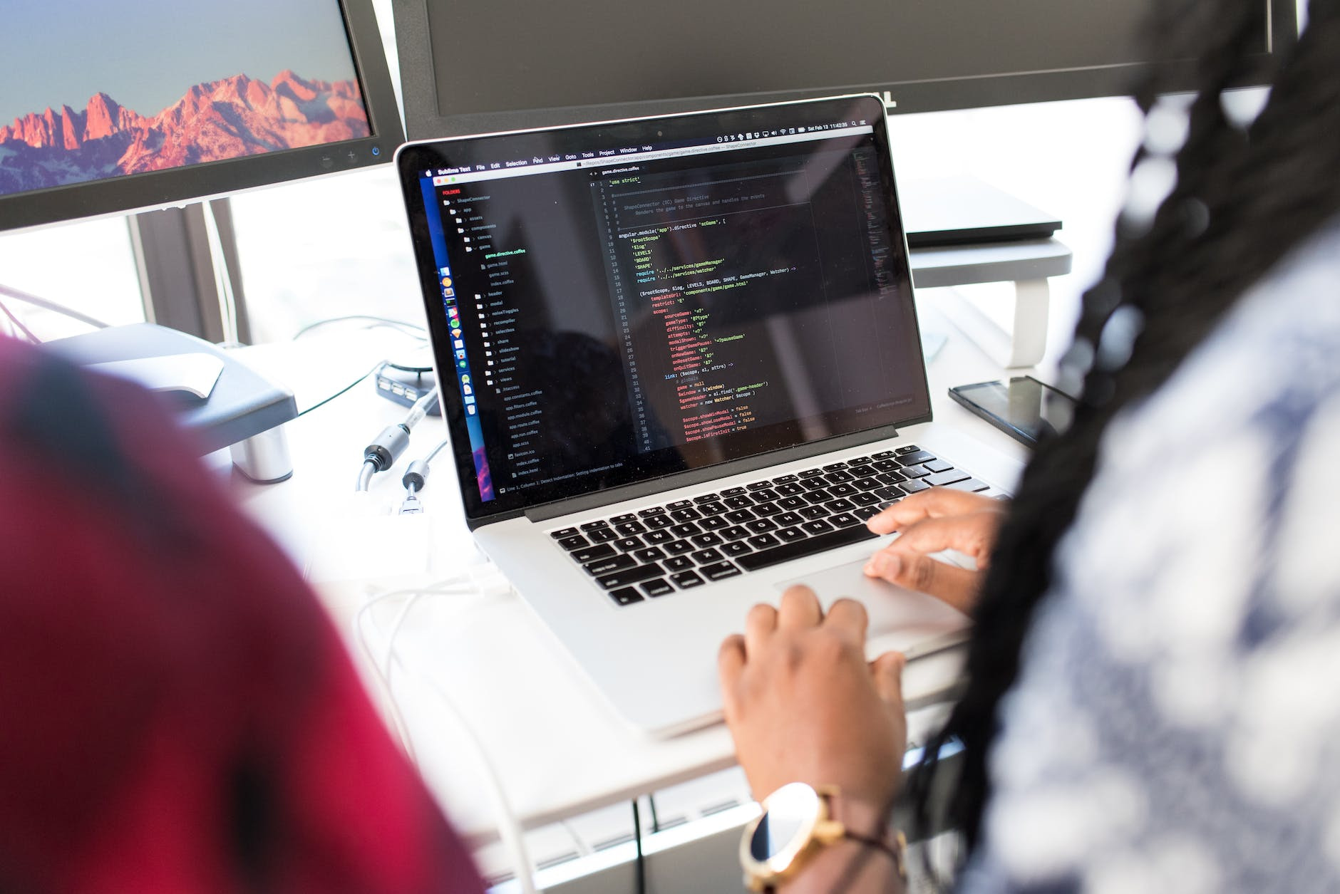 web development person using silver macbook pro