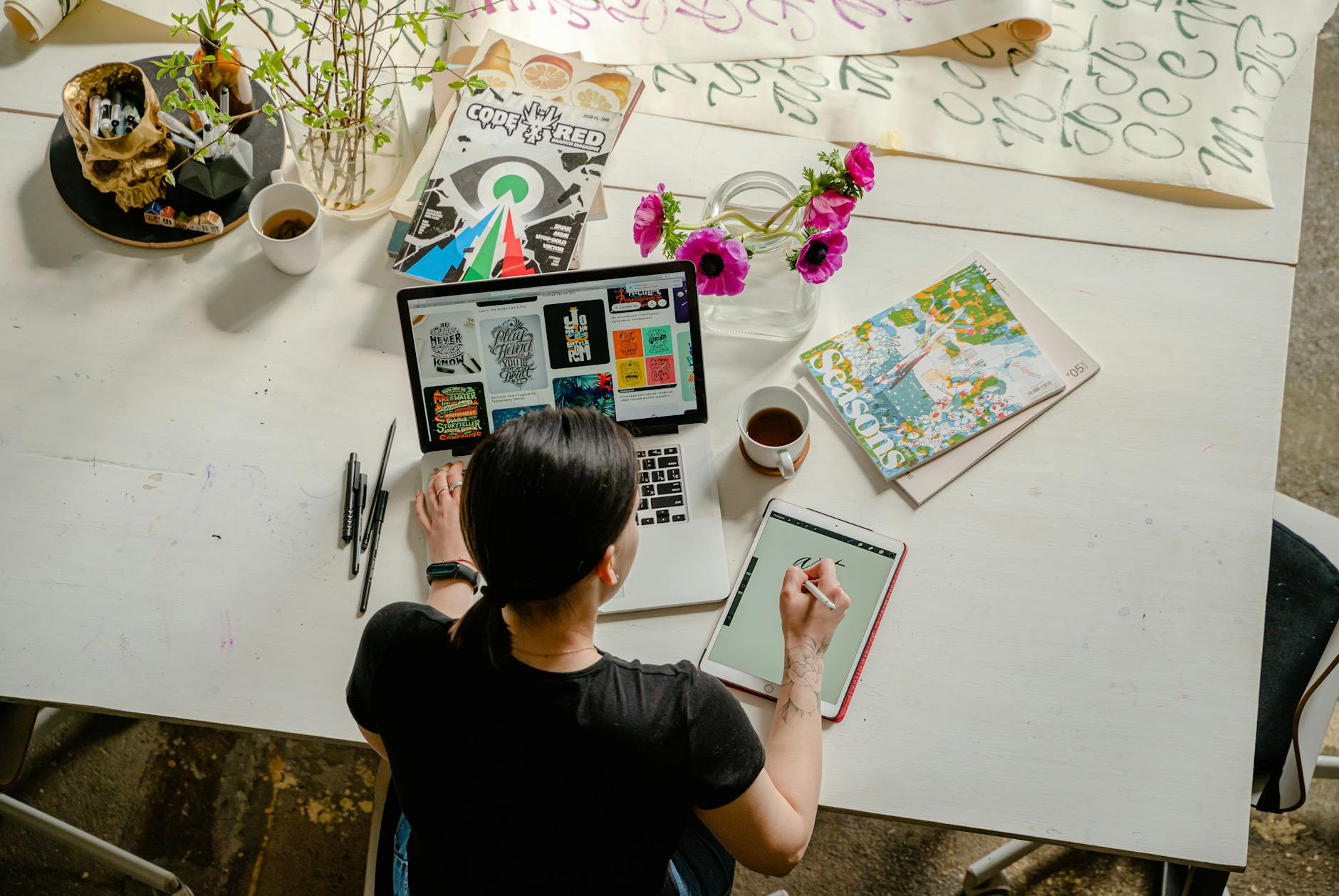 Your First Year in Online Business. photo of woman writing on tablet computer while using laptop