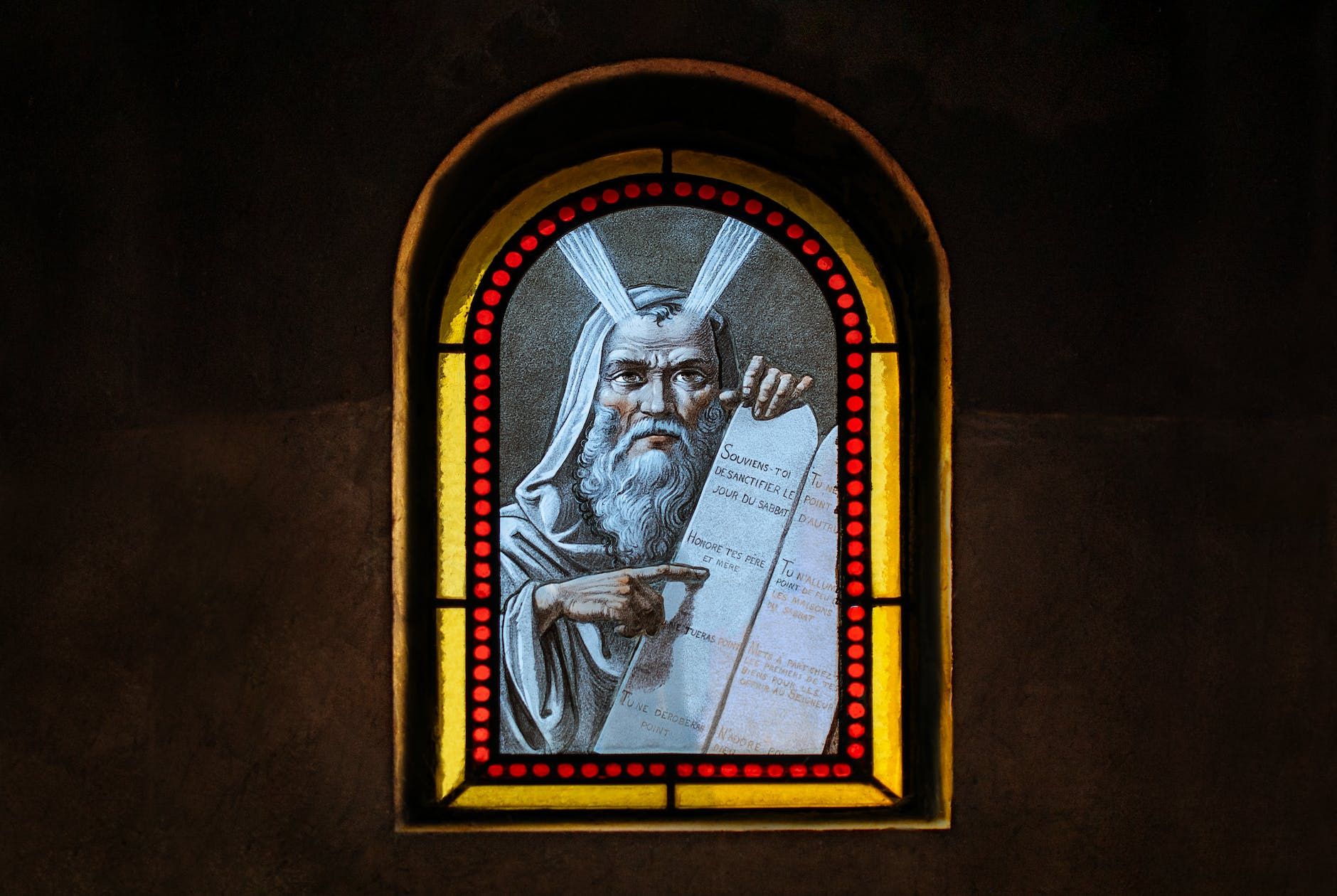 Ten Web Business Commandments: a stained glass window depicting Moses holding a scroll